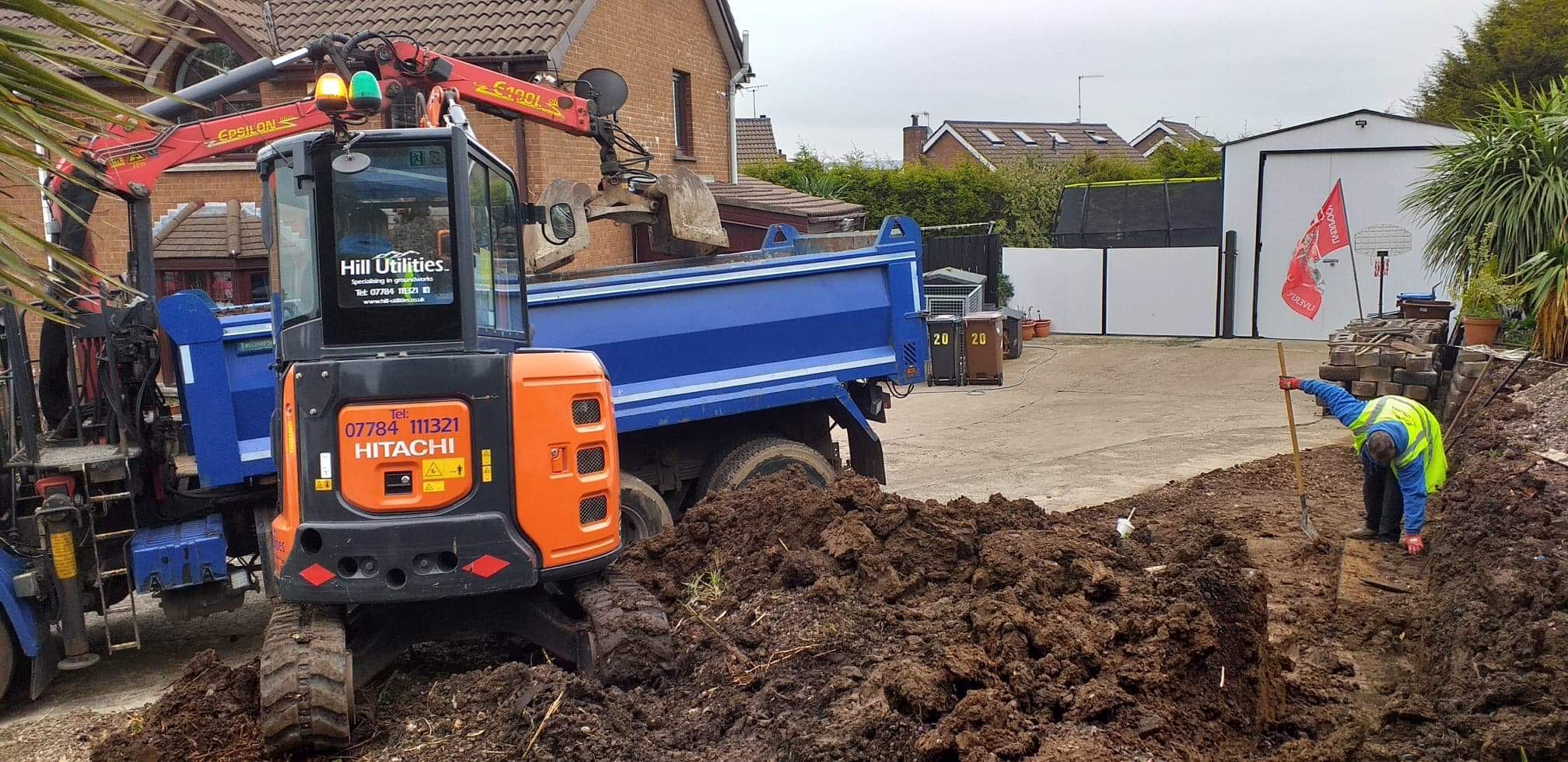 Breaking out an old concrete patio ahead of new groundworks.