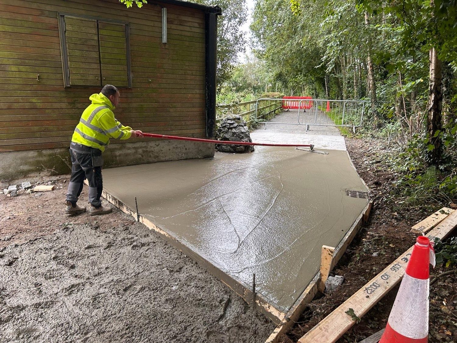 Floating freshly poured concrete for a new park pathway.