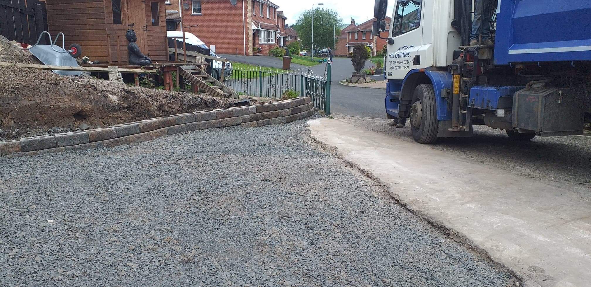 Fresh sub-base and kerb edging laid for a new domestic driveway.
